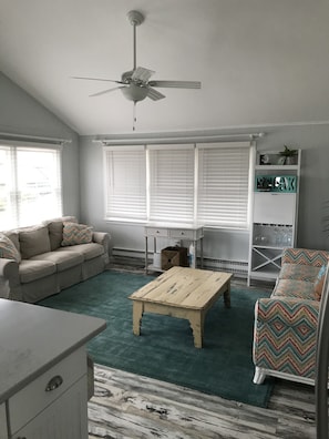 View from kitchen to TV room. Pullout couch is on the right.