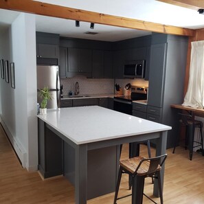 New Kitchen - quartz countertops, new appliances and fully stocked