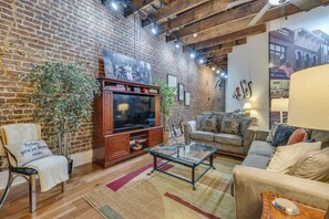 Indulge in a calming evening while watching your favorite shows on a 55-inch HD television equipped with Netflix and cable TV.