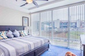 The master bedroom is equipped with a king-size bed that features a comfortable 12" Zinus Green Tea mattress.