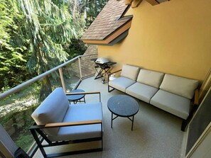 Private patio with outdoor seating, BBQ  & forested views
