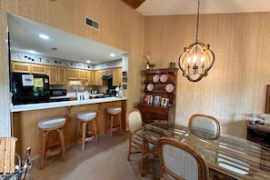 Kitchen with bar stool seating.