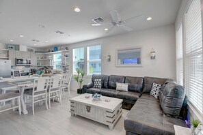 Living Area - The kitchen, dining, and living areas blend seamlessly for a bright and airy feel