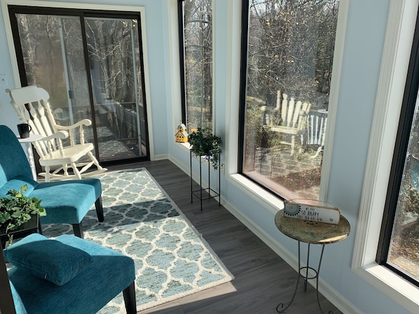 Enjoy coffee, glass of wine, or yoga in our brightly lit sunroom.