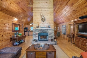 Floor to ceiling fireplace in living room