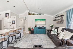 Family room with 75" TV and full Klipsch Surround Sound, with power recliners