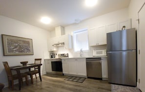 Bright Full Kitchen and eating area.