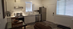 Full kitchen includes stove, oven, microwave, dishwasher and full-size fridge.