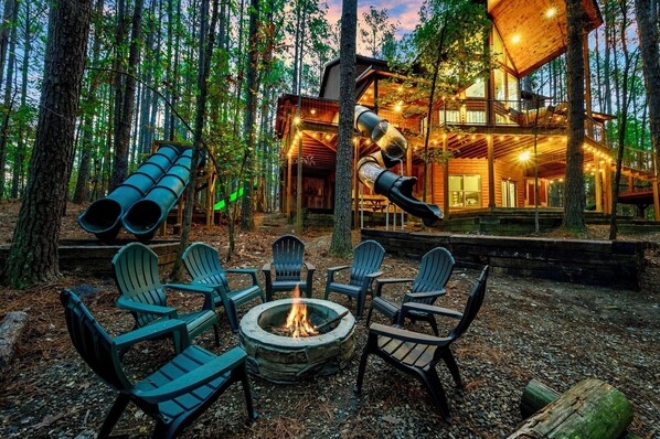 Private retreat with 75ft of slides, backs to national forest, sleeps 16