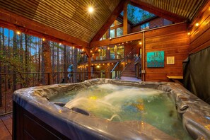 Secluded hot tub area with breathtaking views of the landscape.