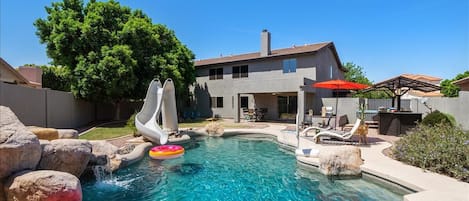 Swimming pool with slide