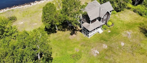 Aerial view of the home and waterfront