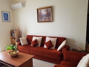 Comfortable  airconditioned living room with large sofa bed if required,