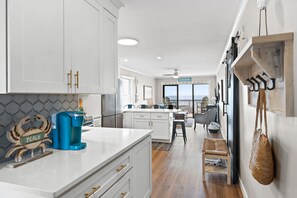 Entryway into kitchen. Large cabinet and drawers are perfect for food storage.