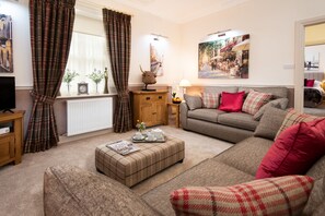 School View - sitting room with two large double sofas