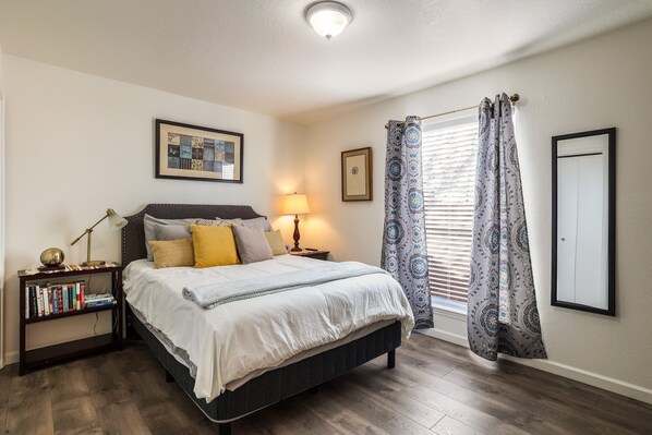 Cozy queen bed with high end mattress and bedding