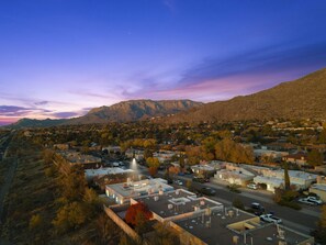 Drone view of the mountain and hiking trails in front of the complex