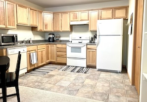 Full kitchen with cookware and utensils.  Washer/dryer in closet (not pictured).