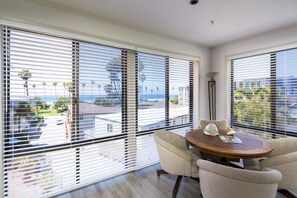 Living room with game table and ocean views and sounds