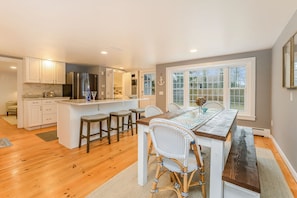 Chefs delight in this modern open concept kitchen / dining area with additional seating for 3 at the center island-75 Pinewood Rd Hyannis Cape Cod- New England Vacation Rentals