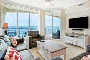 Oceanfront living room with sliders to oceanfront balcony