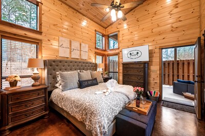 Beautiful king size master bedroom that opens up to the hot tub area with a TV.