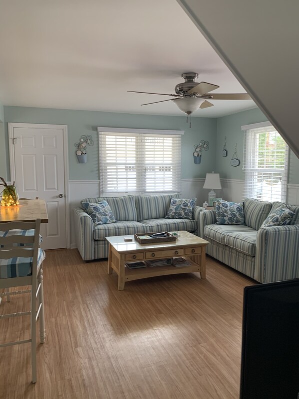 Living room with adjacent laundry area