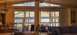 The view of bay from living room and kitchen through floor to ceiling windows