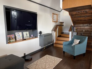 Living room and custom stairs to loft space