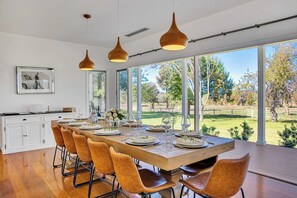 The dining room is bright and stylish with comfortable seating for twelve.
