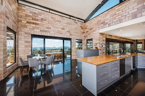 Open plan living frames gorgeous views of the rolling hills that surround you. 