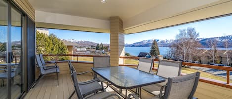 Enjoy lake & mountain views from main level deck with outdoor dining & BBQ grill