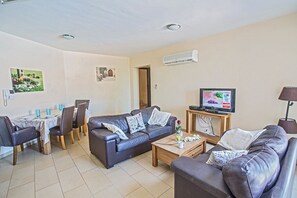 Living room with comfortable seating area and widescreen TV