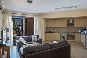 Living room with patio doors leading to the veranda