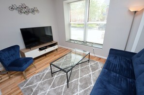Living Room With 55" 4K Smart TV, Cable And DVD Player