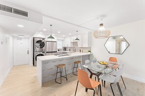 Beautifully designed space with chic decor, stylish dining chairs, and an inviting atmosphere for meals and conversations.
