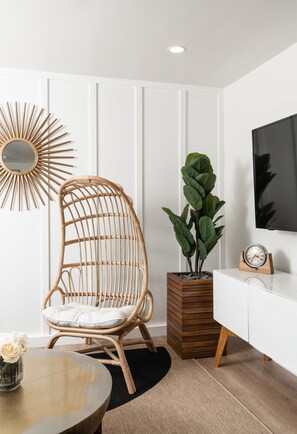 Charming bo-ho style egg chair and sleek furniture. 