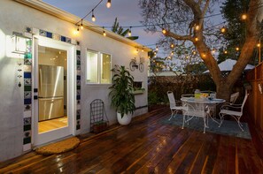 Expansive private deck built around a beautiful tree. Enjoy outdoor dining! 