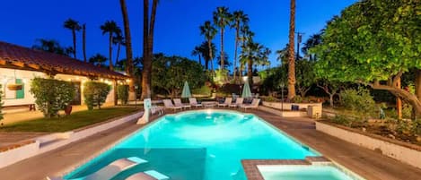 Pool with lounging platform and hot tub that heats up in minutes