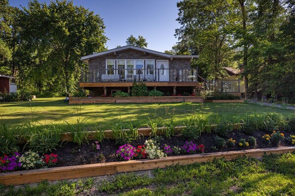 Front yard with flower gardens