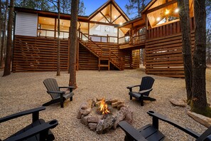 Fire pit located back of cabin.