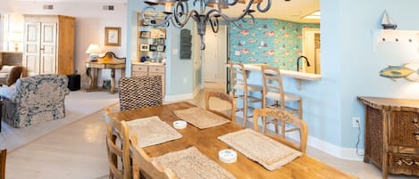 Dining room right by the kitchen bar and kitchen area. Light and Bright