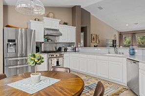 Large kitchen with lots of countertops for cooking, baking and entertaining.