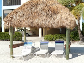 Tiki Huts with Lounge Chairs