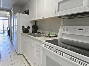Whip up breakfast with ease in this bright and modern Myrtle Beach kitchen.

