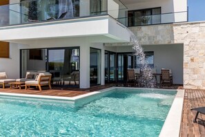 Seating area by the pool on the terrace of the Croatia luxury vacation rental villa in Kastela