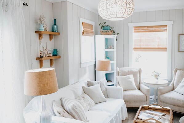 The Inlet Cottage is decorated in elegant creams and whites with a dash of blue