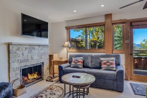 Living room with wood-burning fireplace