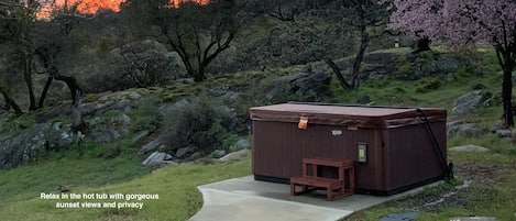 Soak in a secluded hot tub with expansive views and stunning sunsets.