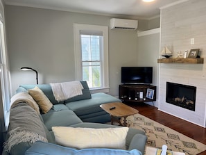 Cozy Couch with fireplace and Roku TV.